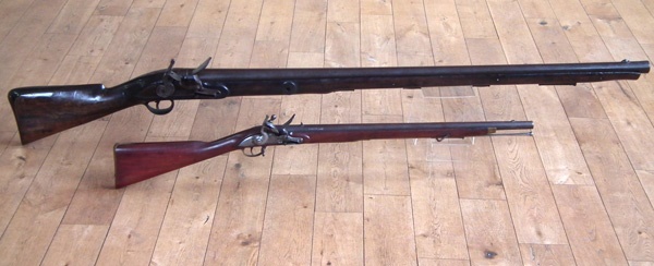 Flintlock wall gun and an East India Company flintlock musket